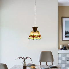 A glass pendant light with a colorful floral band design and a plated finish.