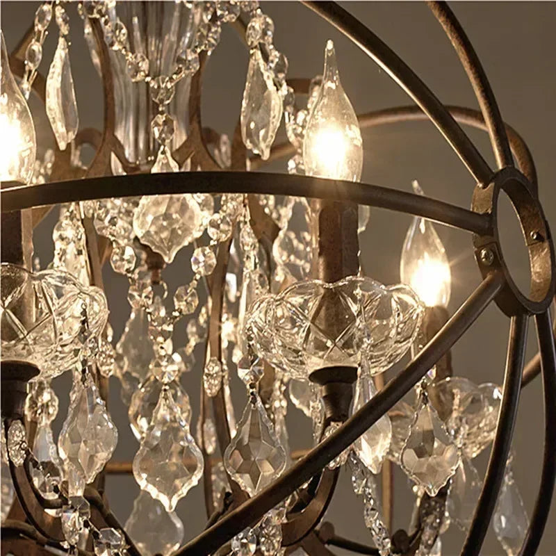 Close-up of a chandelier with crystal elements and warm lighting.
