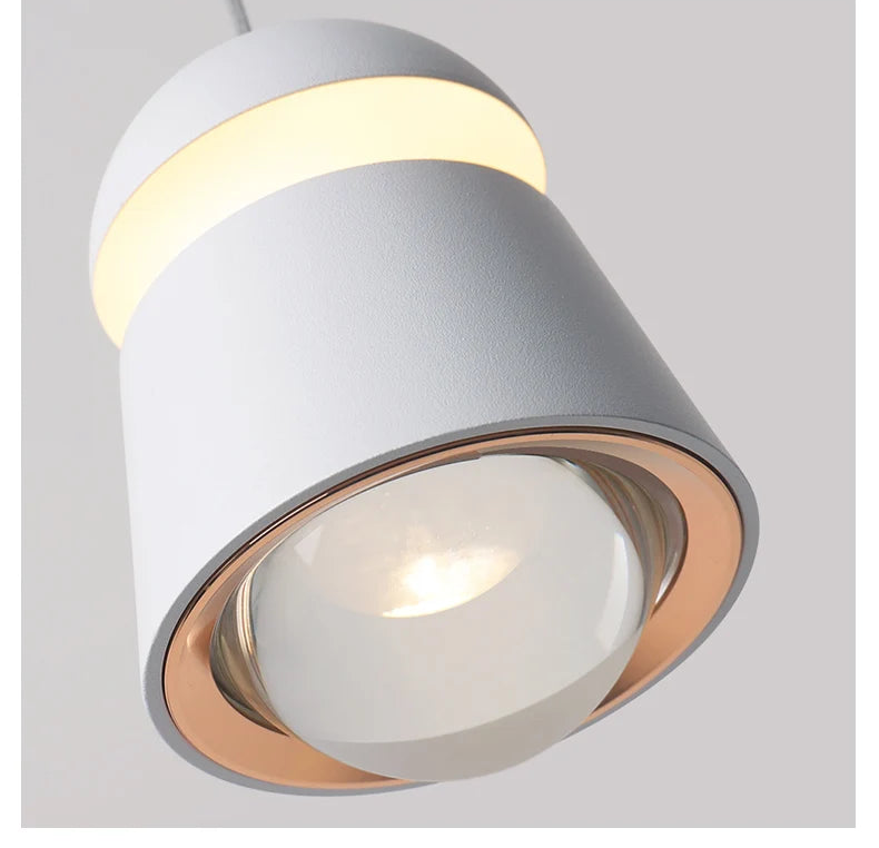 Modern ceiling light fixture with a gray and gold design on a light gray background.