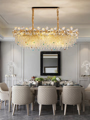 A different angle of the gold petal crystal chandelier, highlighting its multi-tiered design and the sparkle of the crystals.