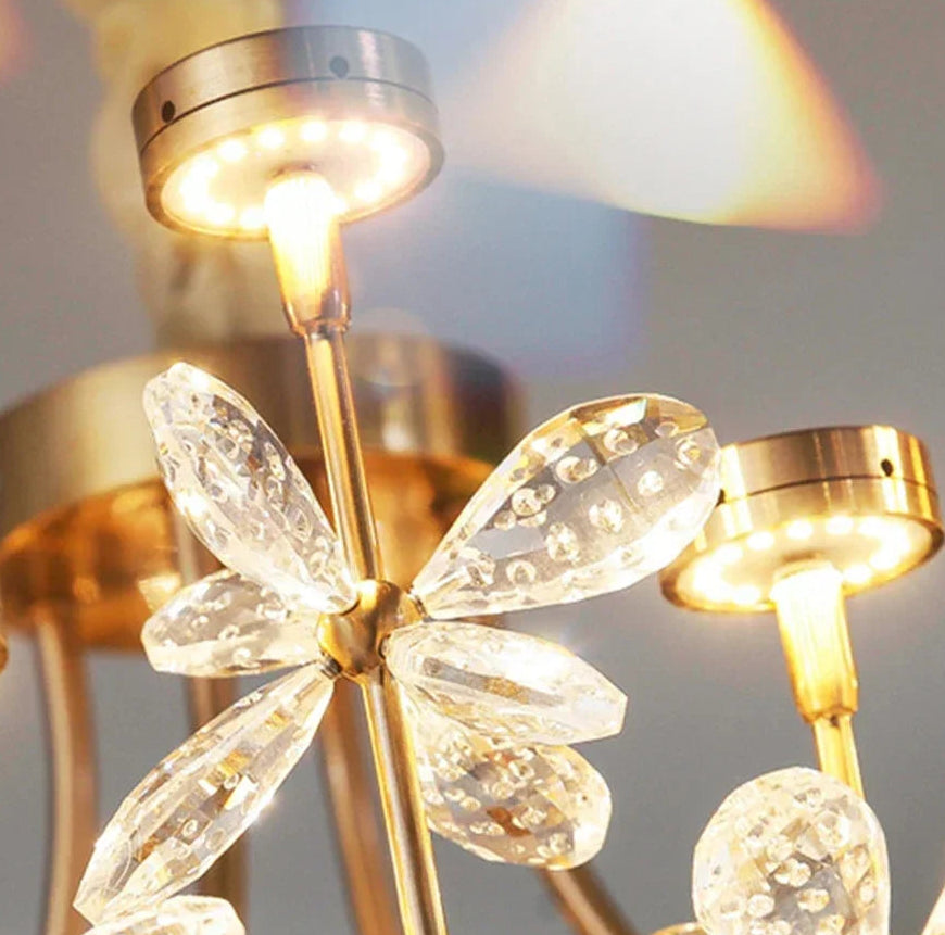 Close-up of a gold chandelier with crystal-like glass shades.