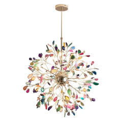 A close-up view of a multi-colored agate slice floral chandelier with a gold frame against a white background.