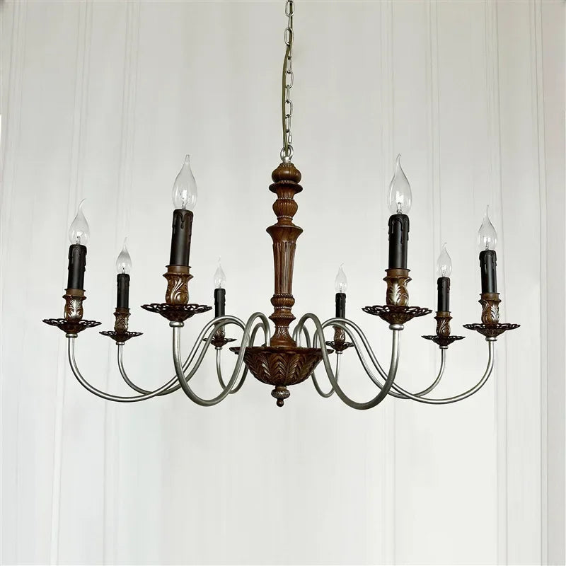 Vintage-style chandelier with wooden fixture and glass shades on a white background