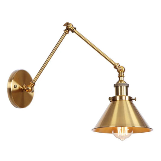 Close-up of the brushed gold adjustable wall sconce's arm and socket.