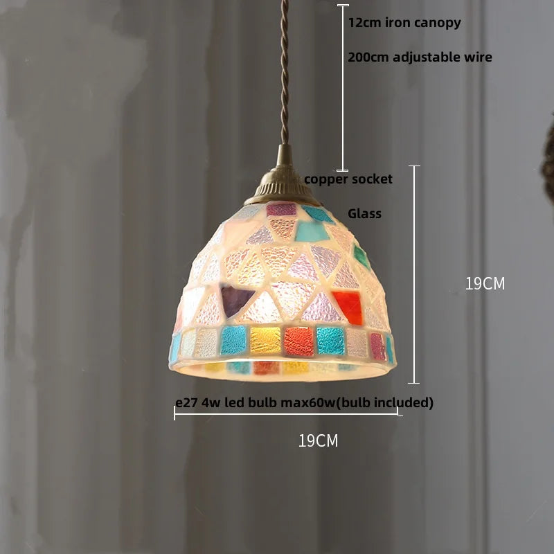 Pendant light with colorful glass shade and measurement details on a gray background