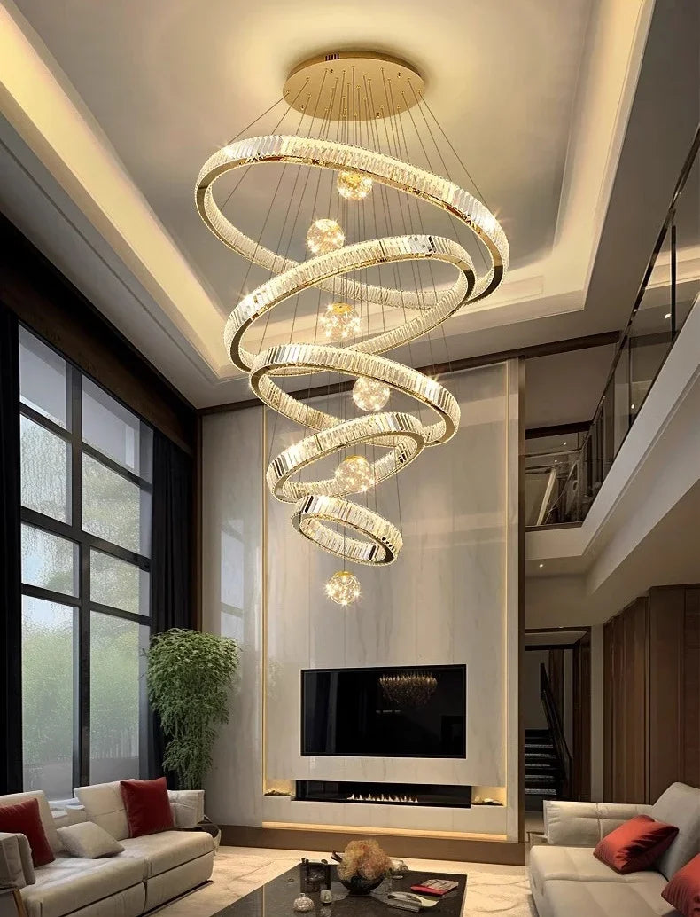 Modern living room with a stylish chandelier, sofa, and fireplace.