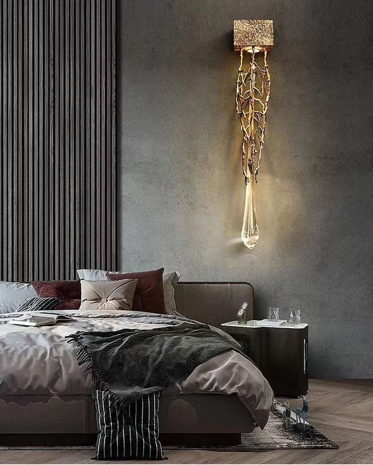 Modern bedroom with a decorative wall light fixture.