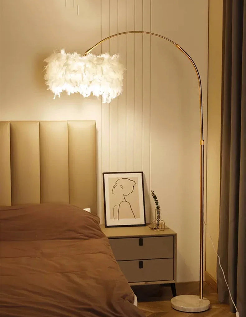 Modern bedroom with a floor lamp, bed, and nightstand.