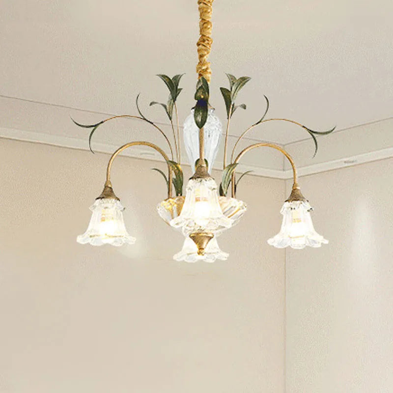 Side view of a gold floral crystal semi-flush chandelier