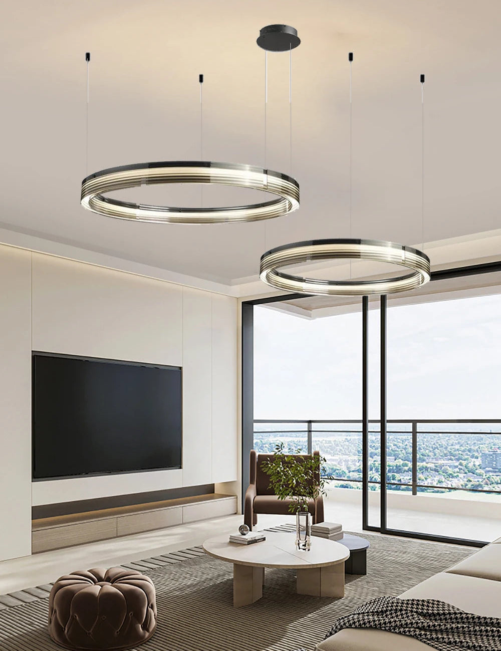 Modern living room with circular pendant lights, TV, and furniture.