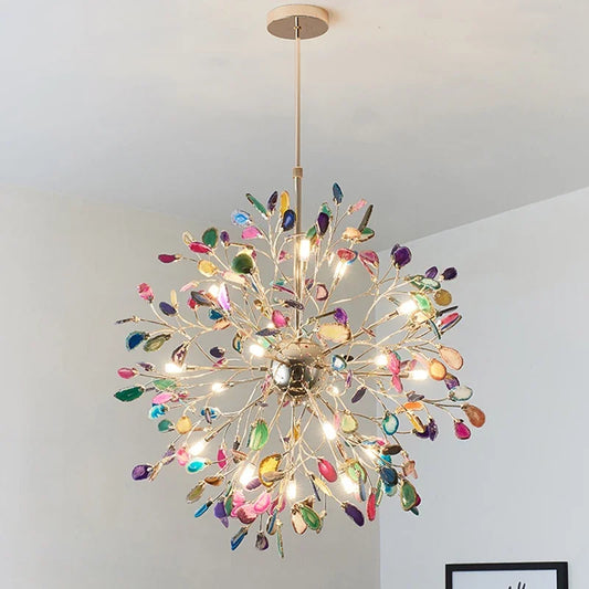 A multi-colored agate slice floral chandelier with a gold frame hanging from the ceiling.