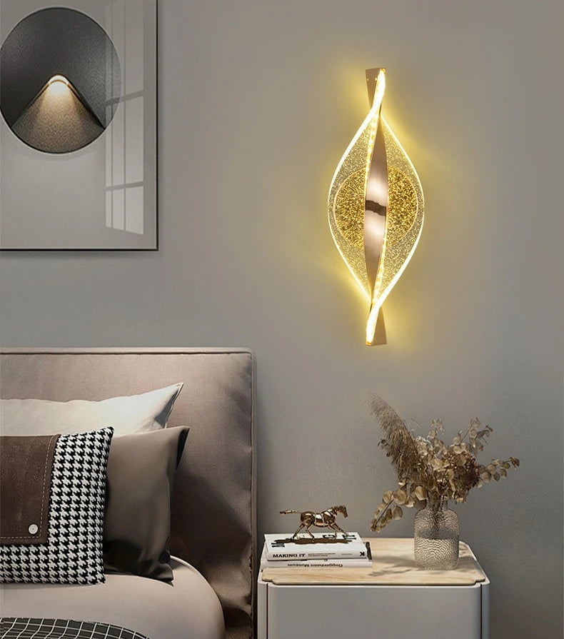 Modern bedroom interior with a decorative wall light fixture.