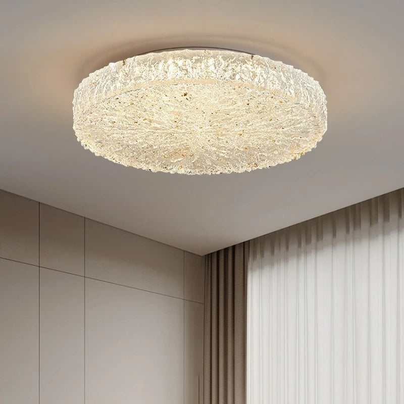 Close-up of the textured gold resin finish on a flush mount ceiling light