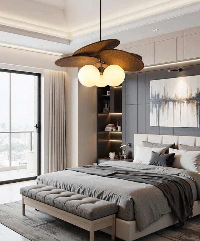Modern bedroom with a bed, lamp, and decor elements.