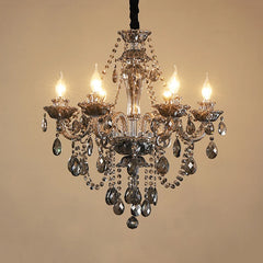 Clear crystal chandelier showcasing a multi-tiered design with numerous sparkling crystal droplets and polished metal frame.