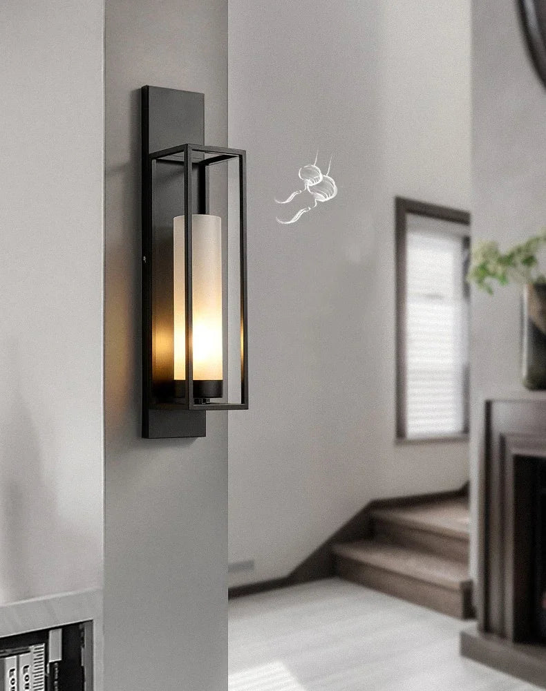 Modern wall sconce in a home interior setting with neutral tones.