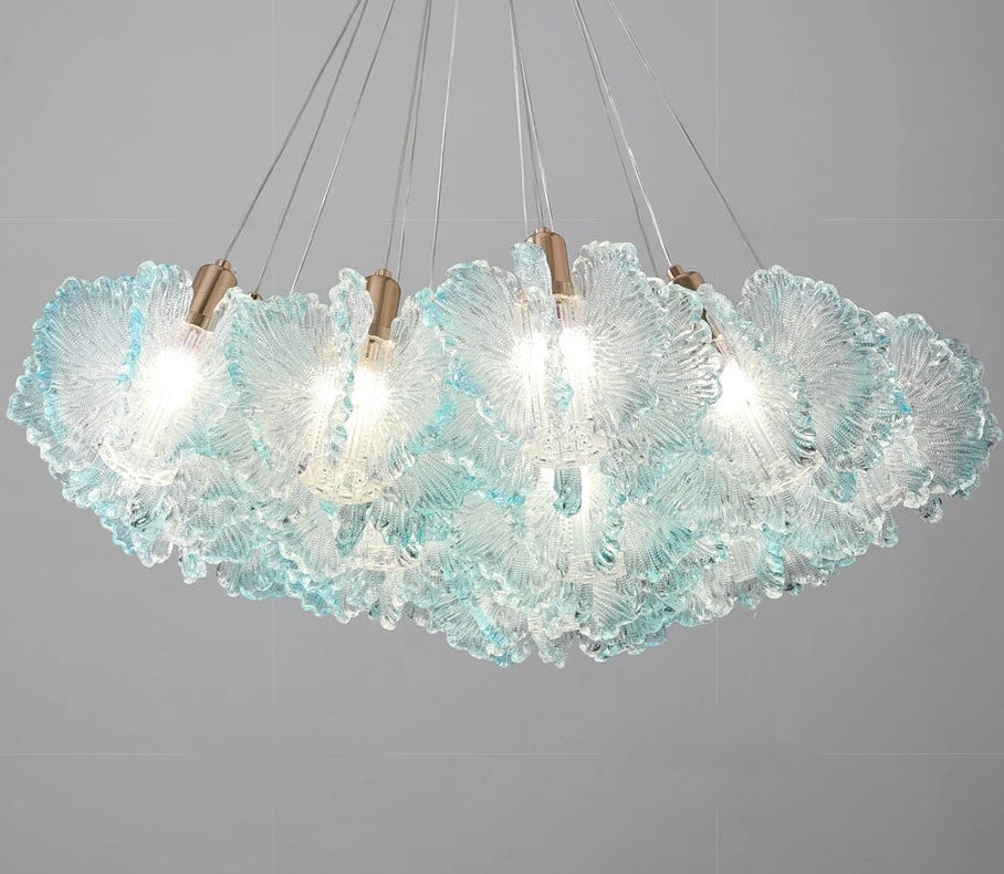Modern chandelier with textured glass shades on a gray background