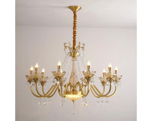 A gold candelabra chandelier with multiple arms adorned with faceted crystals, hanging from a ceiling.