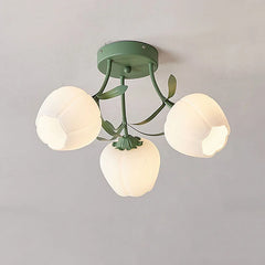 Close-up of a green semi-flush mount ceiling light featuring three white frosted glass tulip-shaped shades with green metal accents.