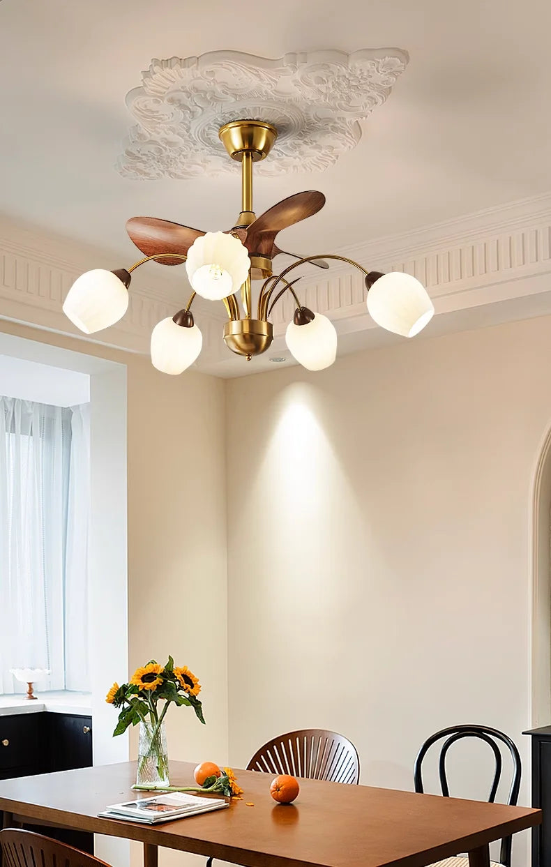 Modern ceiling light fixture in a dining room with a table and chairs.