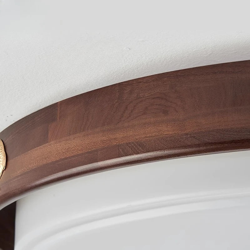 Wooden ring with a gold accent on a white background