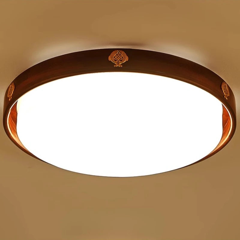 Ceiling light fixture with wooden frame on a beige wall