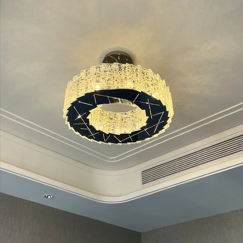 Close-up of the textured faceted crystals on a modern spiral flush mount chandelier.