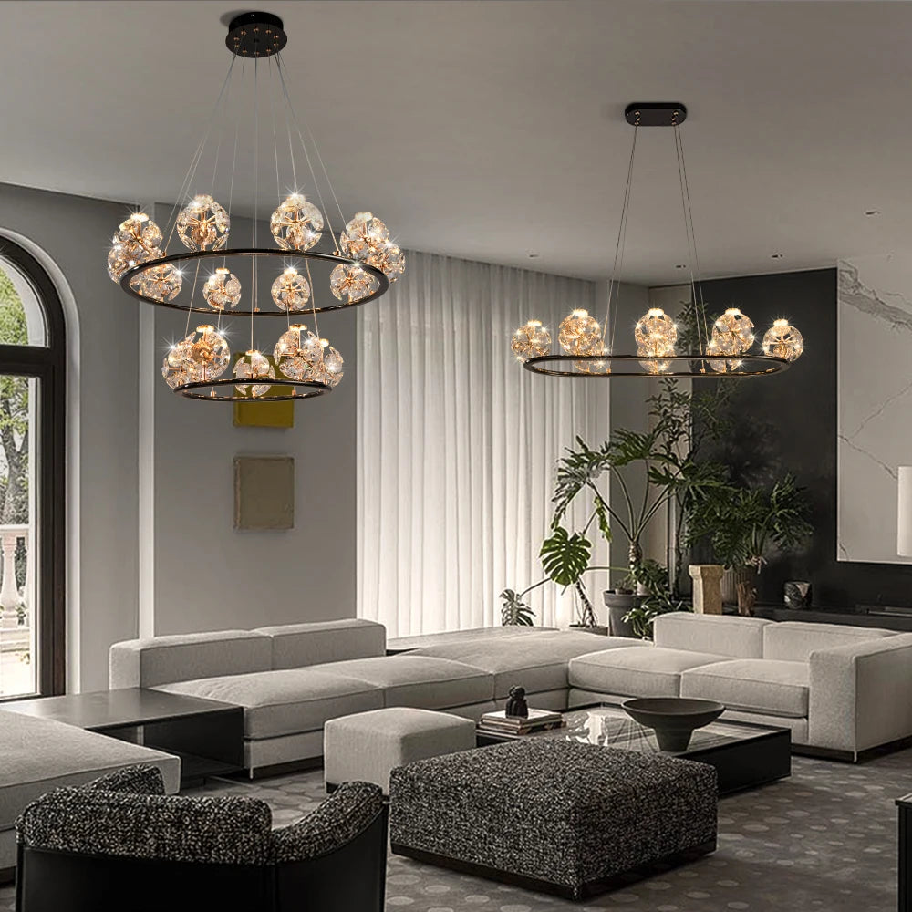 Living room with a large gold chandelier featuring multiple crystal orb lights.