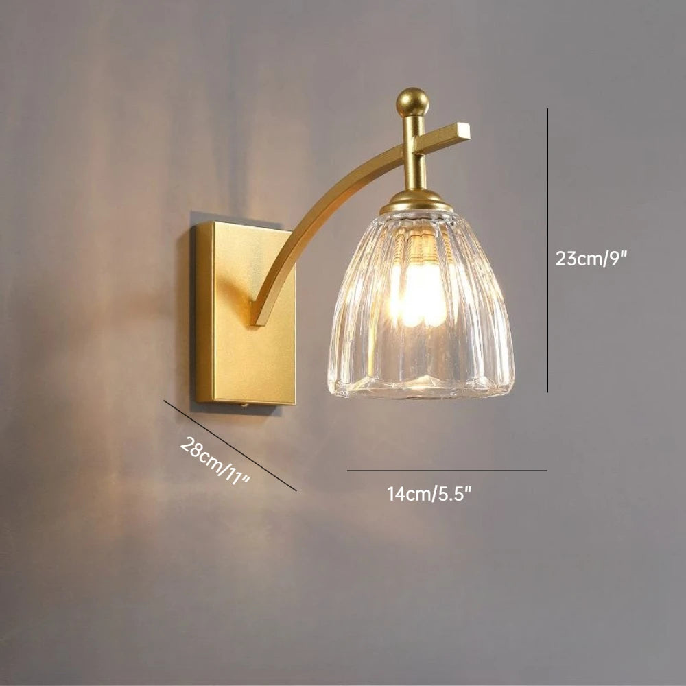 Wall-mounted lamp with gold fixture and clear glass shade on a gray background, showing dimensions.