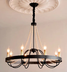 Chandelier with multiple lights on a neutral background