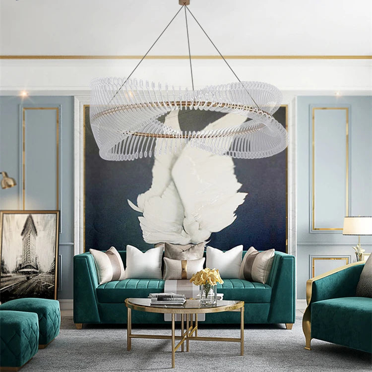 Modern living room with teal sofa, gold coffee table, and decorative wall art.