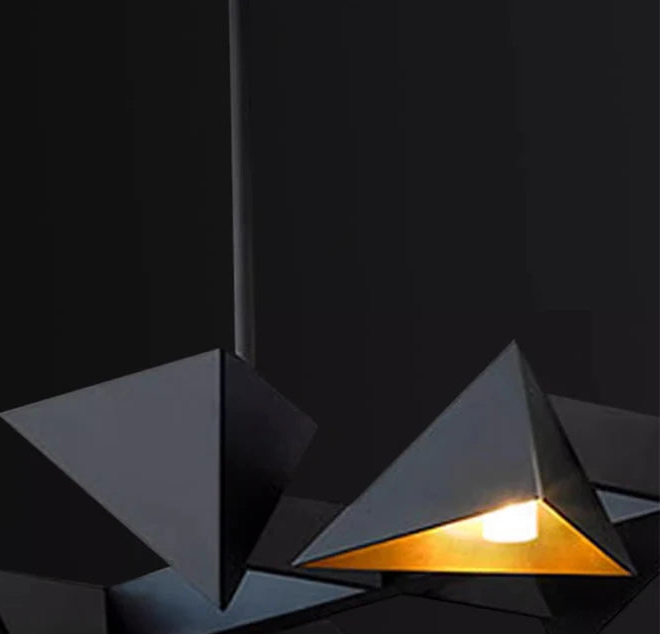 Geometric pendant lights with crystal glass material on a dark background