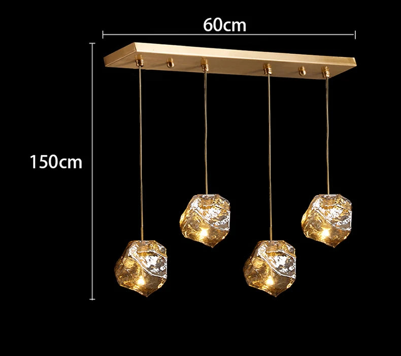 Gold pendant light fixture with crystal-like shades, shown with dimensions on a black background.