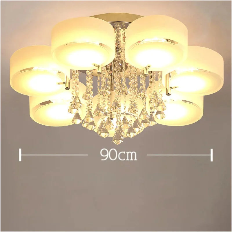 A crystal waterfall pendant light with a chrome finish, showing a measurement of 90cm across its widest point.