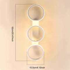 Close-up view of a white LED ceiling light fixture with three rings, showing dimensions.
