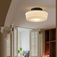 Close-up of the white frosted glass drum semi-flush ceiling light with decorative detailing.