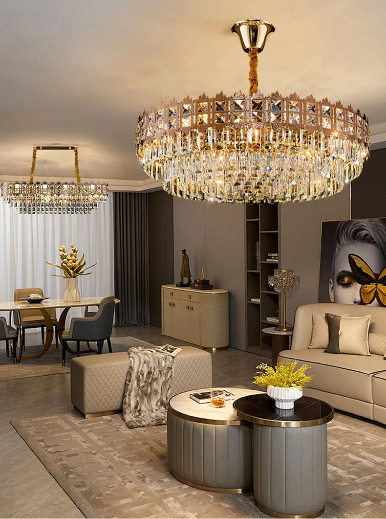 Luxurious living room with a chandelier, sofa, and coffee table.