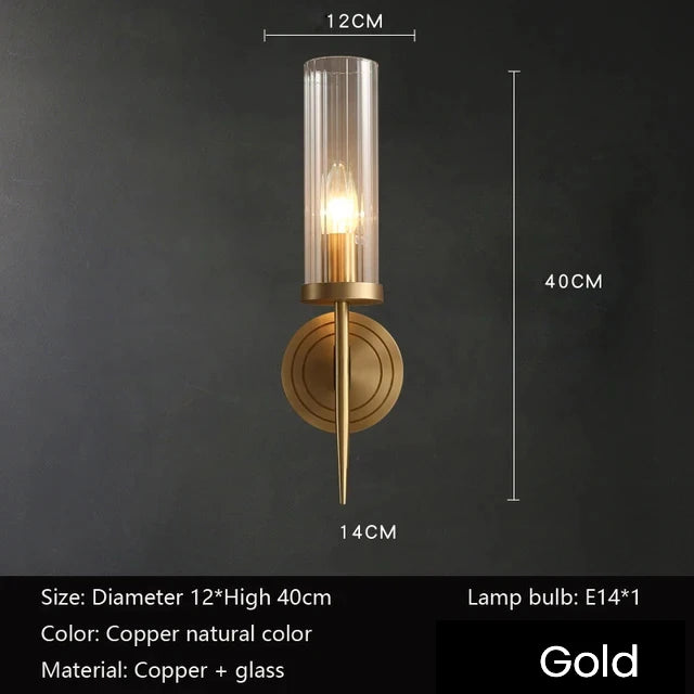 Gold wall sconce with dimensions and bulb information on a dark background