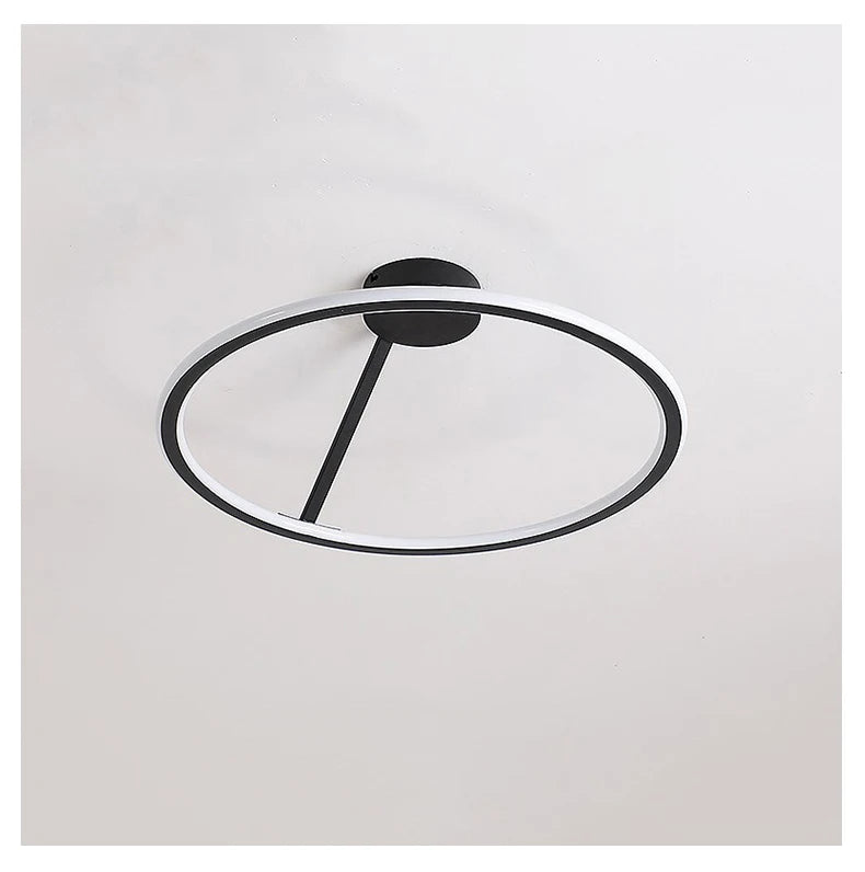 Modern ceiling light fixture with black and clear design on a white background