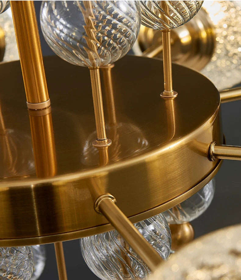 Gold chandelier with glass shades on a dark background