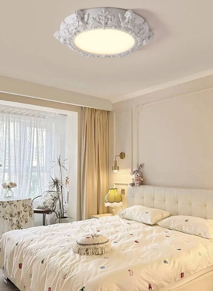 Bedroom with a decorative ceiling light fixture