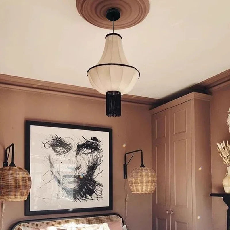 Modern interior design with a chandelier, wall art, and decorative elements.