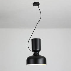 A matte black dome pendant light hanging from a black ceiling mount with a contrasting cord detail.