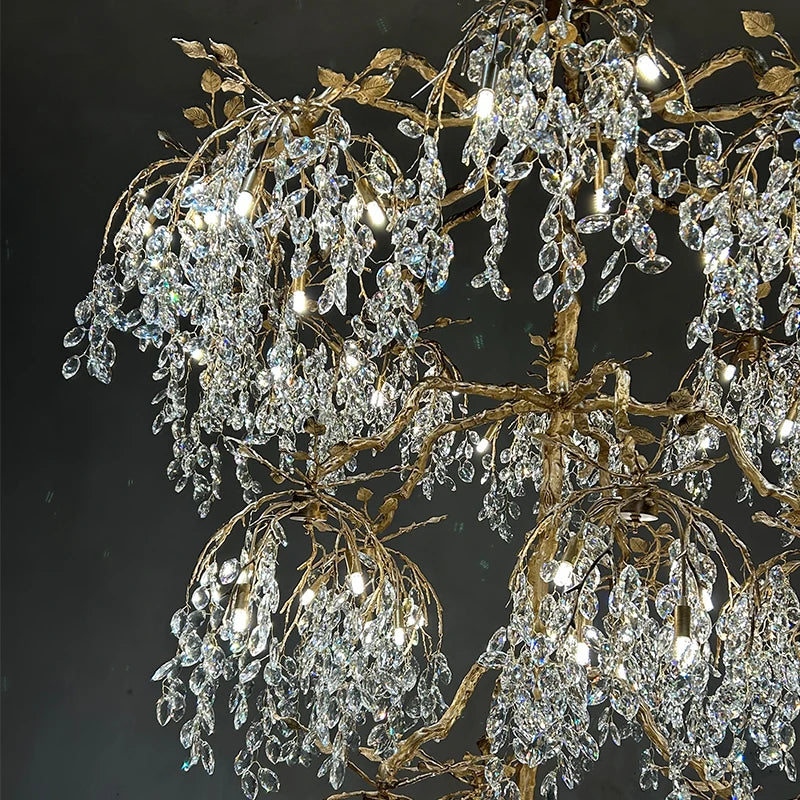 Luxurious crystal chandelier with gold branches against a dark background