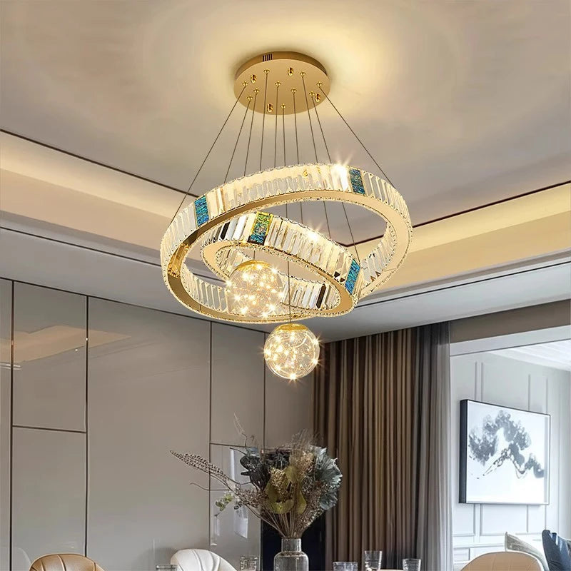 Modern chandelier hanging in a room with neutral decor
