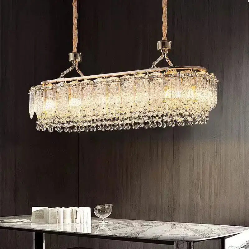Crystal chandelier hanging above a table with a dark background