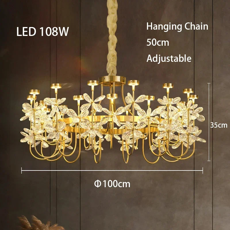 Gold chandelier with leaf-like design on a dark background, featuring dimensions and LED wattage.