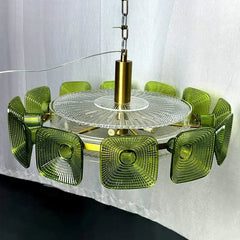 Close-up view of the green glass square geometric chandelier showing the textured glass and central clear diffuser.