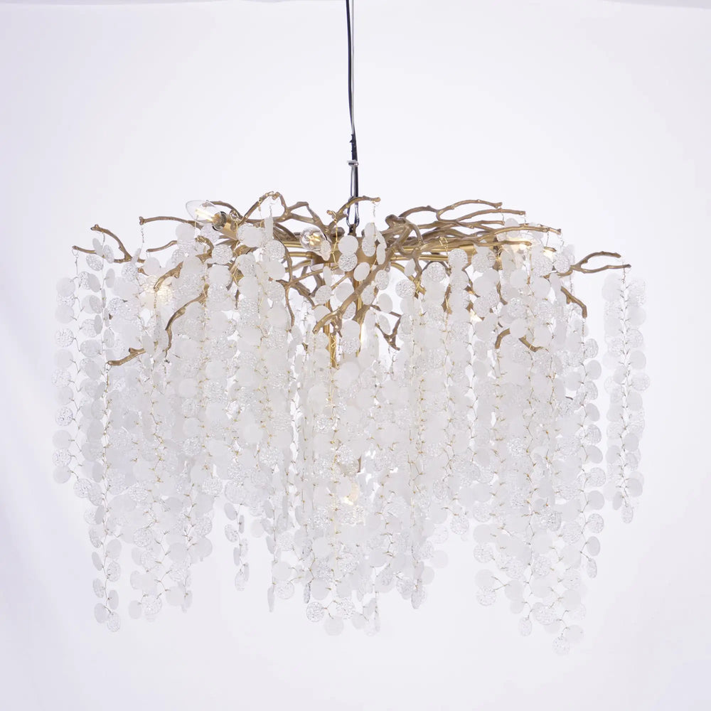 Chandelier with white beads and gold accents on a white background