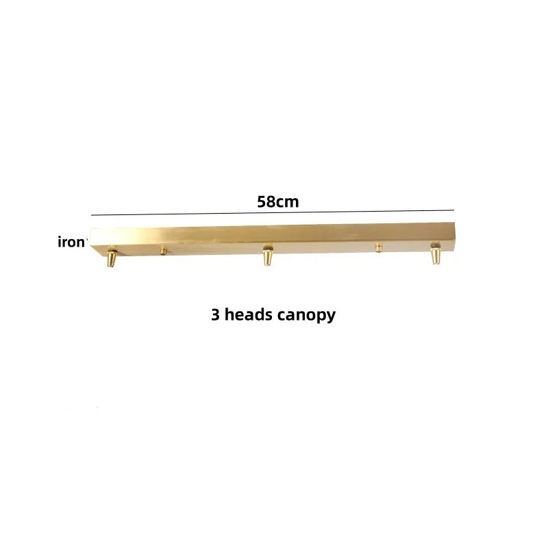 Gold iron with three heads and a measurement label on a white background